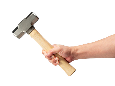 Hammer in hand isolated on a white background.