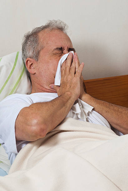 istock Sick man with flu in the bed 187113220