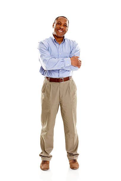 istock Happy mature man with his arms crossed standing on white 187113290