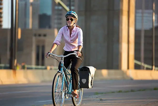 Photo of Bicycle Commuter in The City Riding Home From Work.