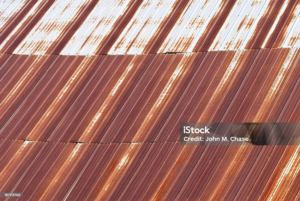 Close-up of a rusted tin roof Close-up of a rusted tin roof atop an old barn in New England. Agricultural Equipment Stock Photo