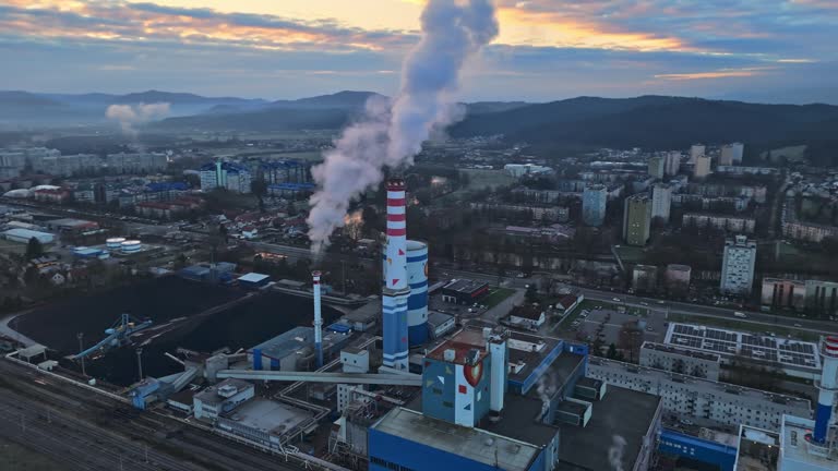 AERIAL Drone Shot of Air Pollution by Coal Fired Power Station in Ljubljana City Under Cloudy Sky at Sunset