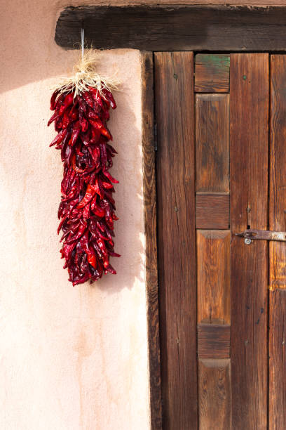 istock Santa Fe, NM: Chili Pepper Ristra and Rustic Old Brown Door 1871139183