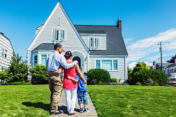 istock Happy Young Family Admiring Home 187114575