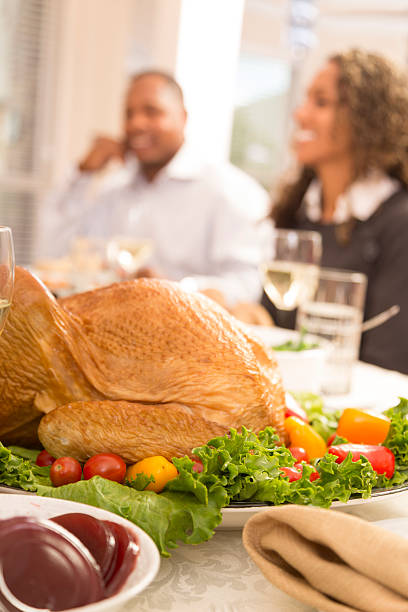 istock Food:  Family prepares to enjoy Thanksgiving dinner. 187114854