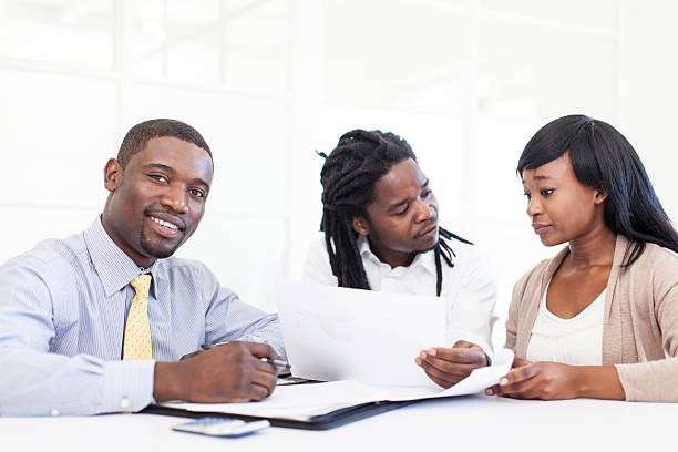 istock Couple speaking to their Financial Advisor 187114857