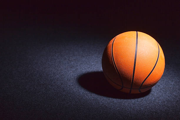 istock Basketball On A Dark Floor 187116047
