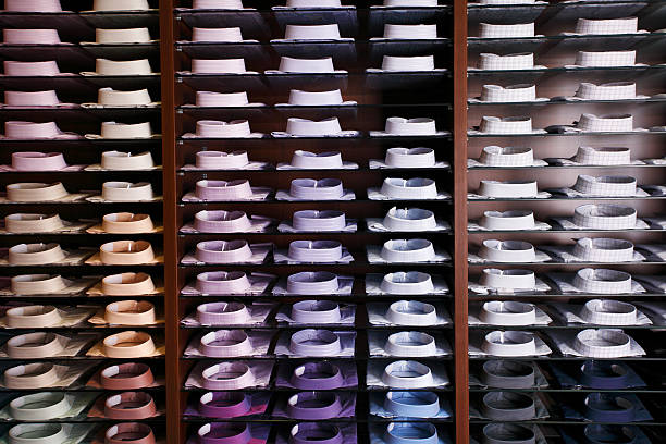 istock Colorfull shirts in a shop with one missing 187116120