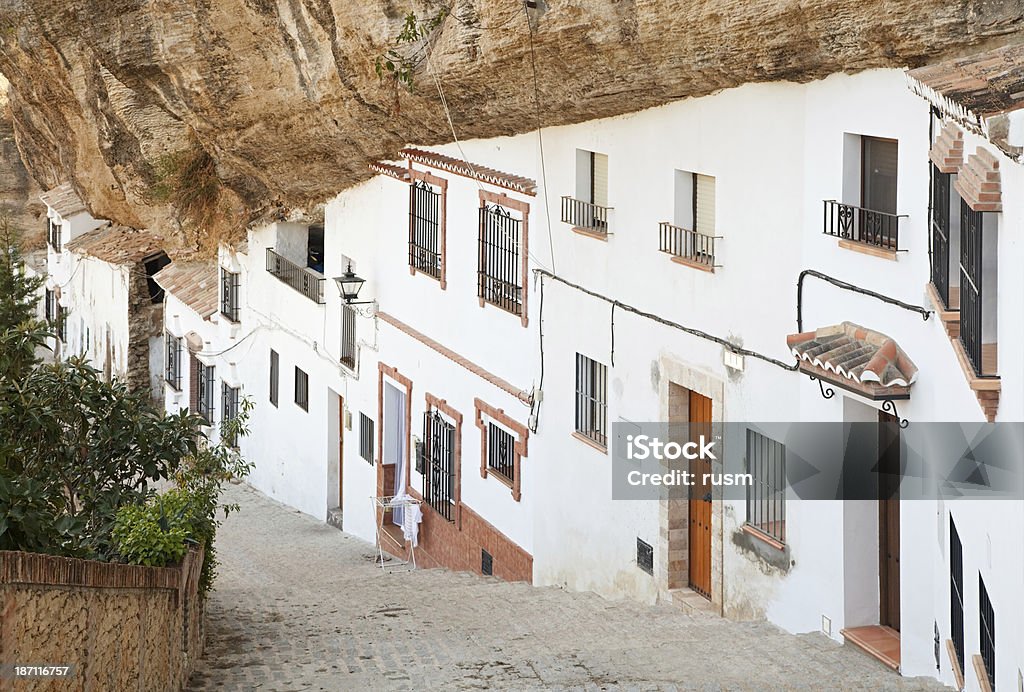 Houses under the rock, Spain Typical street in Setenil de las Bodegas, small town in Cadiz, Spain Setenil Stock Photo