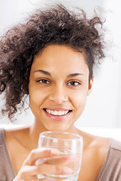 istock Beautiful woman drinking water. 187117034