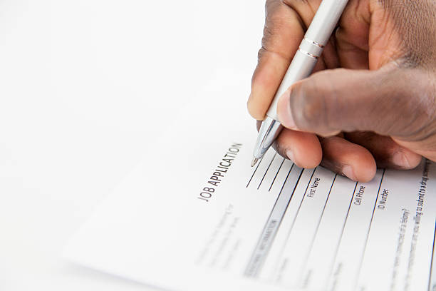 Businessman filling in an application form, South Africa.