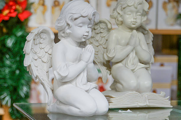 istock Kneeling praying angels for sale 187117250