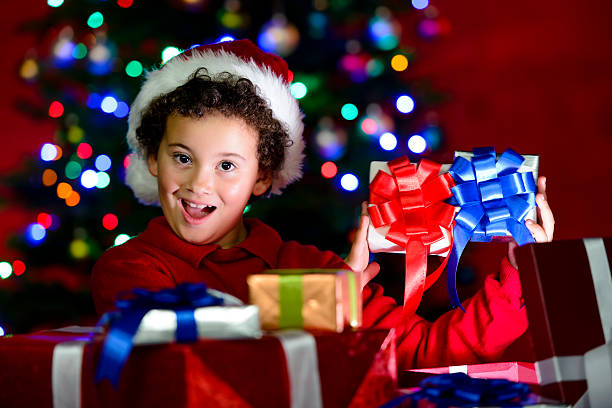 istock Excited child showing christmas gifts 187117541