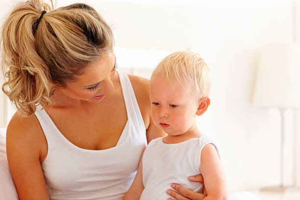 istock Caring young mother and son together - Indoors 187117808