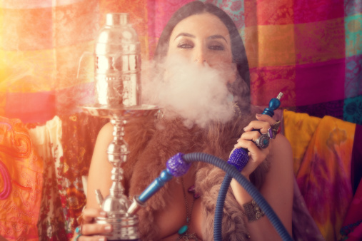 hippie girl smoking water pipe