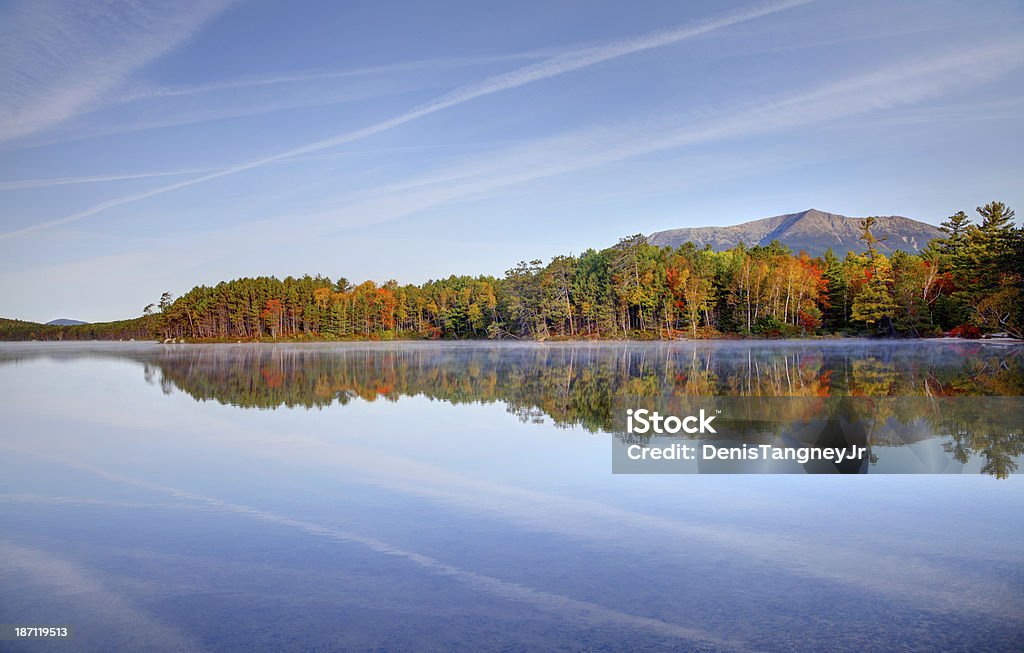 Autumn Reflection Mount Katahdin is the highest mountain in Maine. Katahdin is the centerpiece of Baxter State Park: a steep, tall mountain formed from underground magma. Photo taken during the fall foliage season. Maine fall foliage ranks with the best in New England bringing out some of  the most beautiful foliage in the United States Mt Katahdin Stock Photo