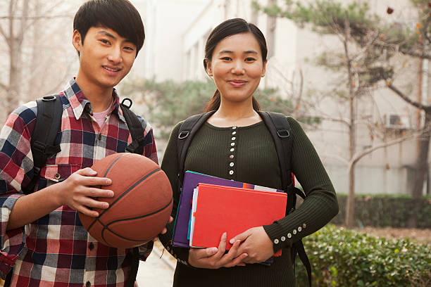 istock Two students portrait on college campus 187120087