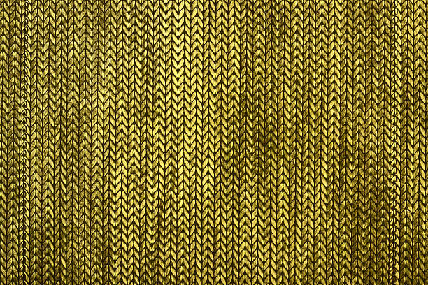 Knitted Textile Close Up Aged and distressed dirty knitted textile in black, and yellow tones chain mail stock pictures, royalty-free photos & images