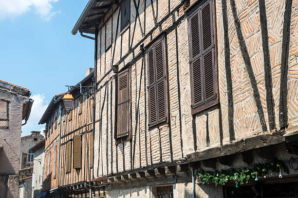 Quaint old buildings with colourful shutters in the streets and squares of Figeac, Lot 46, France, Europe