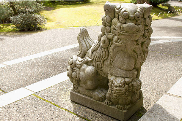 istock Japanese Stone Guardian Lion with Cub Sculpture 187120359