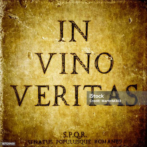 In Vino Veritas Sign On A Stone Textured Bacground Stock Photo - Download Image Now - Alcohol - Drink, Alcohol Abuse, Bar - Drink Establishment