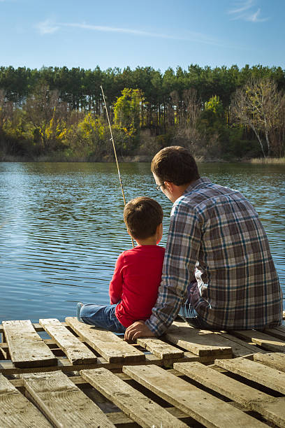 istock Father and son fishing 187120710