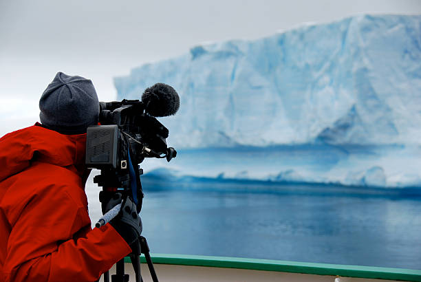 istock cameraman filming an iceberg 187120946