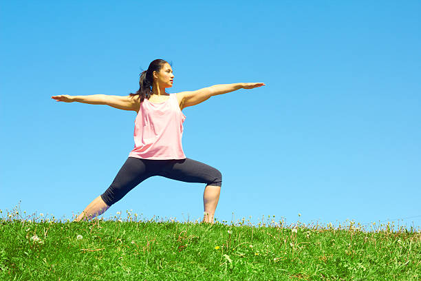 istock Young Beautiful Mixed Race Woman Doing Yoga Warrior Pose 187121182