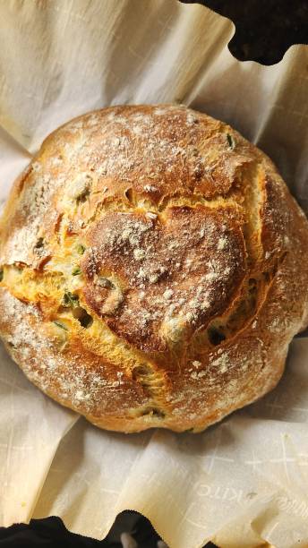 istock Fresh baked crusty French bread with heart 1871214342