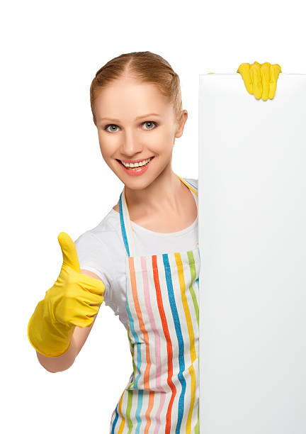 istock happy  housewife thumbs up with white empty billboard 187121553