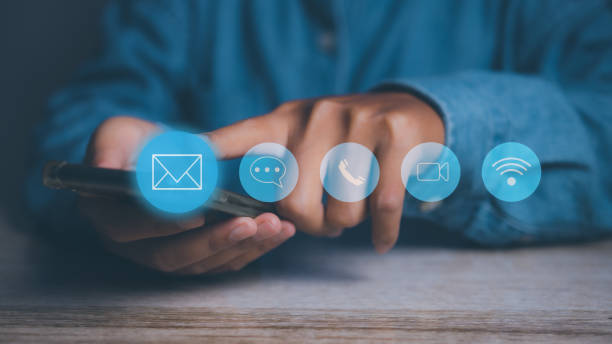 istock CONTACT US, Businessman using mobile smartphone support hotline people connect with contact icons (email, address, live chat, internet wifi). Customer service call center concept. copy space. 1871229642