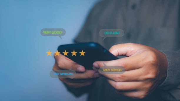 istock Businessman using smartphone giving high score for feedback review satisfaction service. Customer satisfaction experience with five star icon and excellent for feedback review satisfaction service. 1871229650