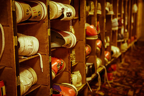 Under the counter shoe cubby for antique bowling shoes.  Vintage tone and vignetting added for effect.