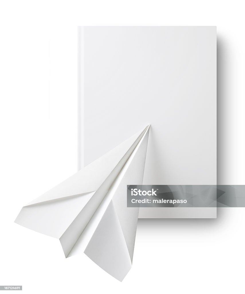 Paper airplane on book Paper airplane on book. Paper Stock Photo