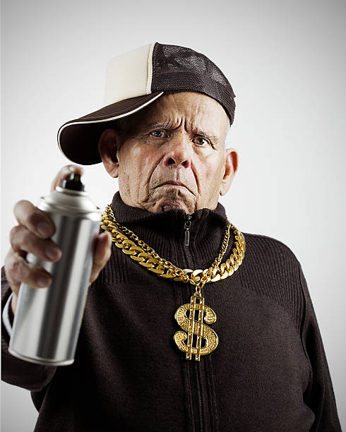 Old school Grandfather oldschool. Old man with a cap, spray and golden chains pimp hat stock pictures, royalty-free photos & images