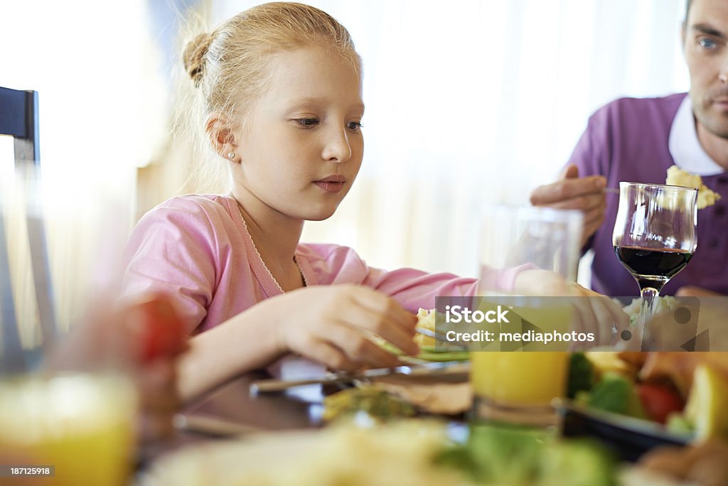 Having a dinner Little girl during family dinner 30-39 Years Stock Photo