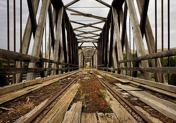 Abandoned Bridge Abandoned bridge from the Drumheller Valley. drumheller stock pictures, royalty-free photos & images
