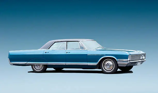 Classic 1960's American car. Isolated image with the background in blue