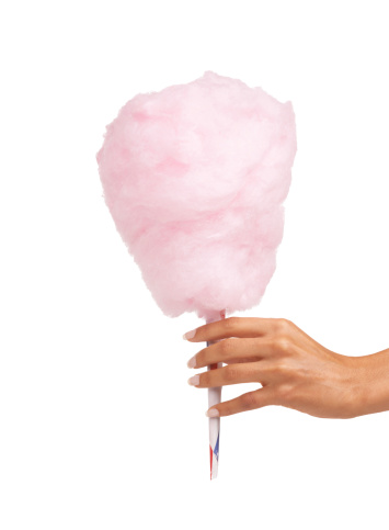 Cropped image of a woman holding some delicious candy floss while isolated on white