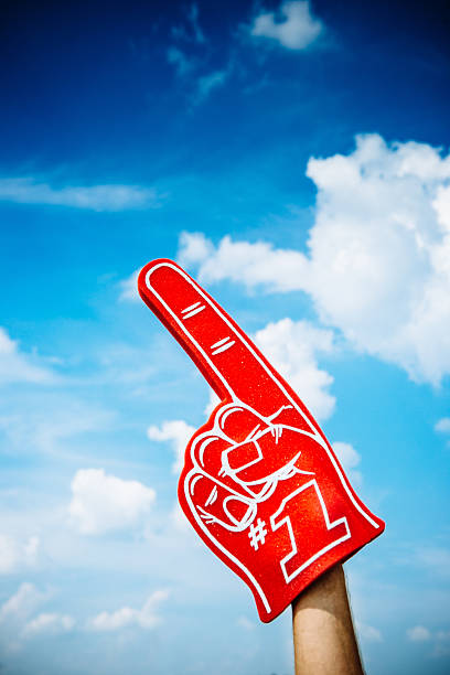 American Football Fan American Football Fan raising foam finger hand fan photos stock pictures, royalty-free photos & images