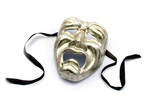 Silver theatre mask on a white background