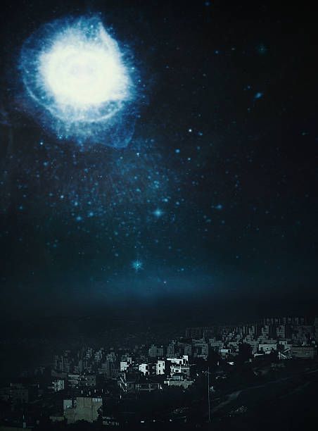 A conceptual photo montage.  The town is literally modern day Bethlehem, and the Christmas star is depicted in the night sky that tradition holds shone the evening that Jesus Christ was born. Vertical image with copy space.