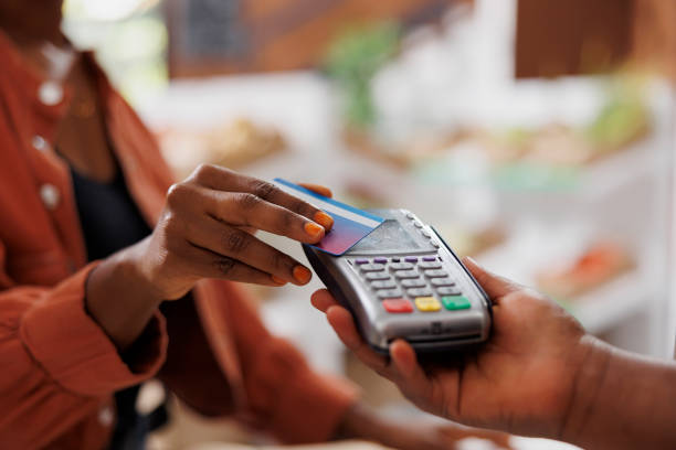 istock Black person using card for payments 1871304051