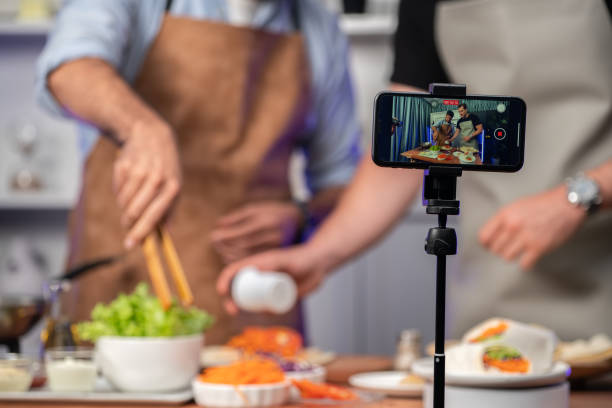 istock Cropped view of chef influencers presenting fresh salad roll. Sellable. 1871305078