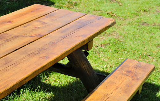 A picnic table on grass.