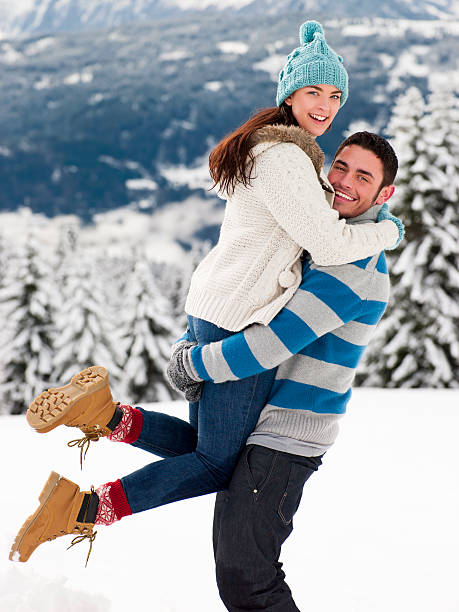 istock Young Couple In The Snow 187130953