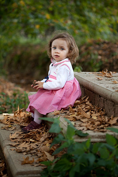 istock cute girl in park 187131270