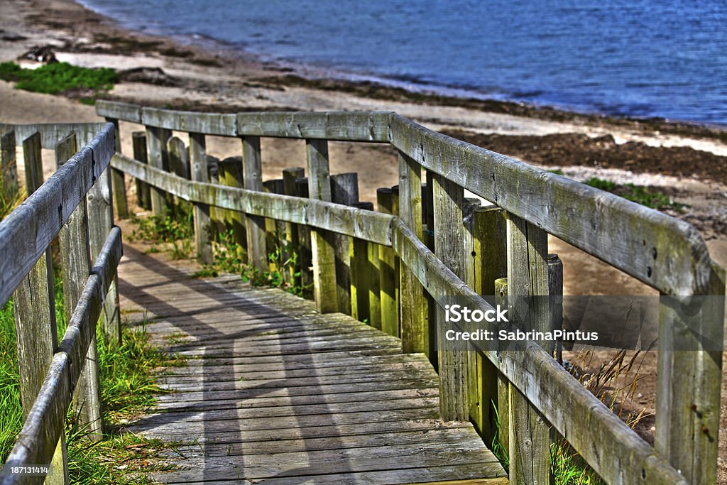 boardwalk to the sea Bannister Stock Photo