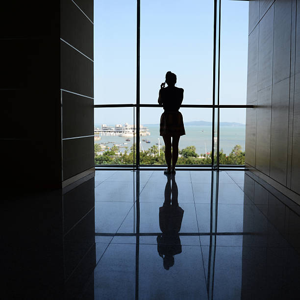 istock woman walking into the light 187133062