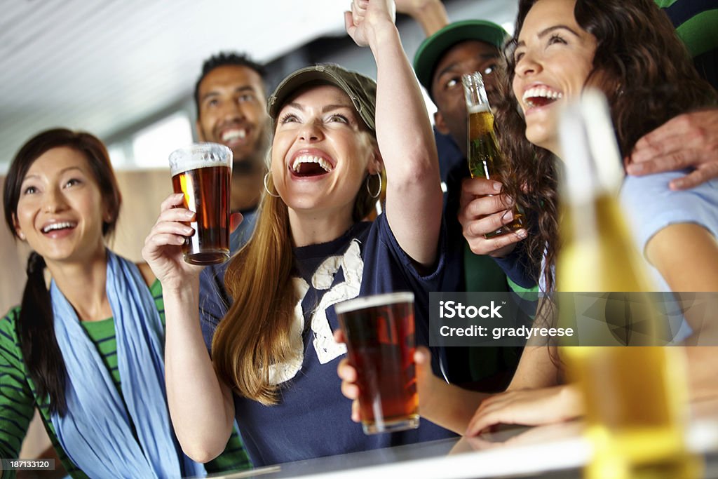 Drinks and sports with friends! A group of excited friends cheering on their favourite team at the barhttp://195.154.178.81/DATA/i_collage/pu/shoots/784804.jpg Sport Stock Photo